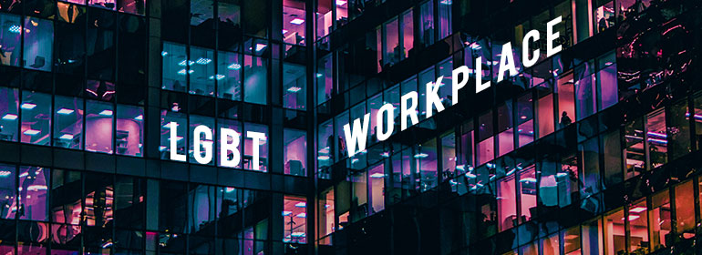 An office with blue and pink lights and the words LGBT workplace overlaid