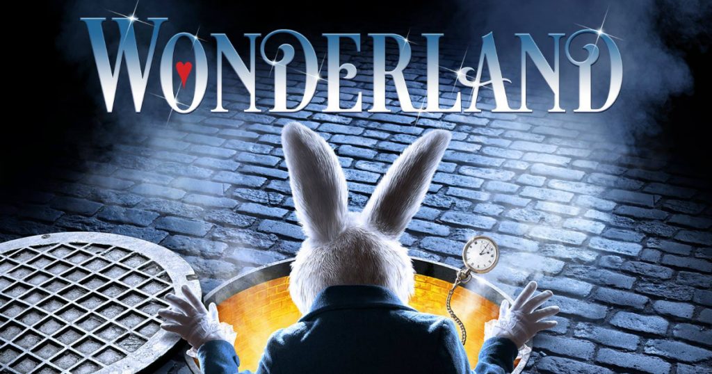 A poster for the show Wonderland at the Bord Gáis Energy Theatre with a white rabbit coming out of a yellow rabbit hole