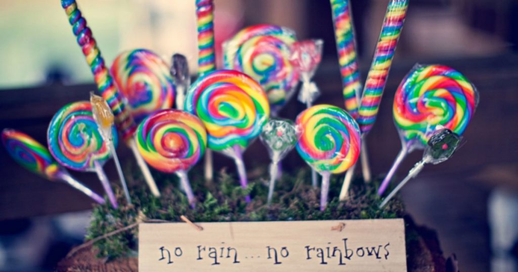 A basket of rainbow coloured lollipops to highlight the inclusive Rainbow Weddings same-sex marriage company