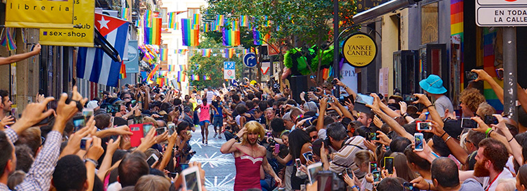 People celebrating World Pride in Madrid a place in Europe which faces hepatitis a outbreak in MSM this year