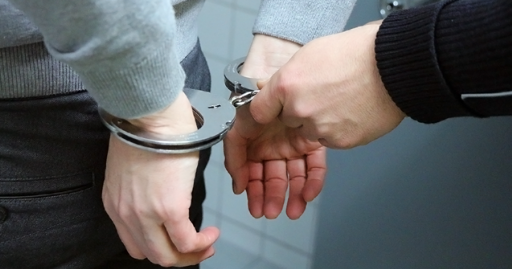 A person being handcuffed perhaps because they got arrested under the current drug laws in Ireland