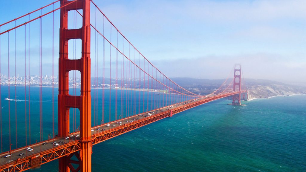 San fran golden gate bridge with blue water beneath it
