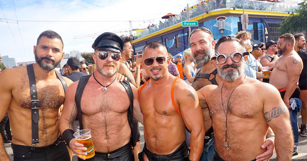 Four topless musclemen at Folsom Street Fair