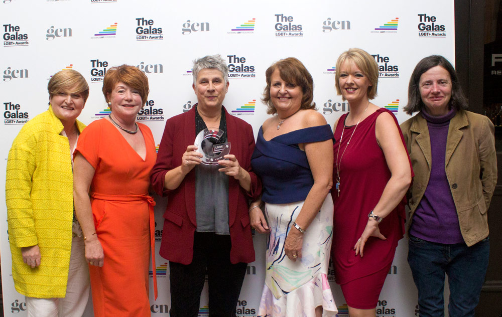 The parents from LOOK holding their award at the GALAS 2017 in front of a branded background