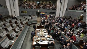 Photo of australian parliament during the members vote. The majority are sitting on the right side of the screen in favoour of the vote whilst four remain on the opposition bench.