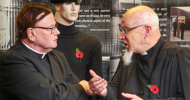 Two elderly priests discussing Church matters