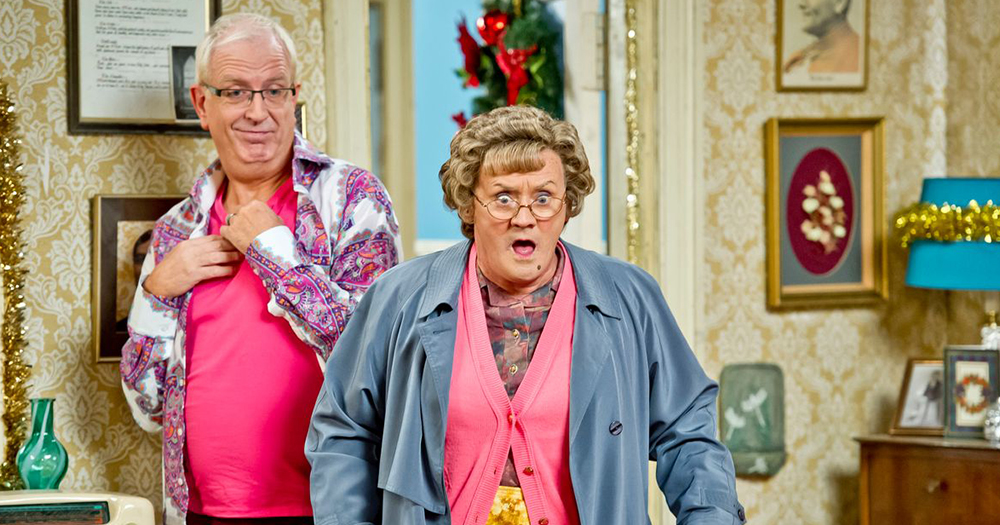 Rory and Brendan O'Carroll as Mrs Brown in the sitting room. Mrs Brown and Rory both looks shocked