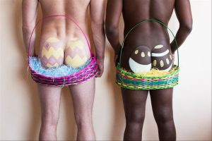 Two butts painted as Easter eggs standing side by side