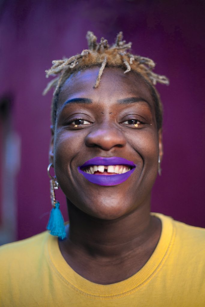 Yemi Azamosa, one of the stars of The Mouth Of A Shark, smiling at the camera