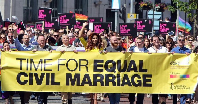 A group of protester marching for equal marriage, holding the sign 'time for equal civil marriage.' Sinn Féin president Mary Lou McDonald has now expressed support for marriage equality.