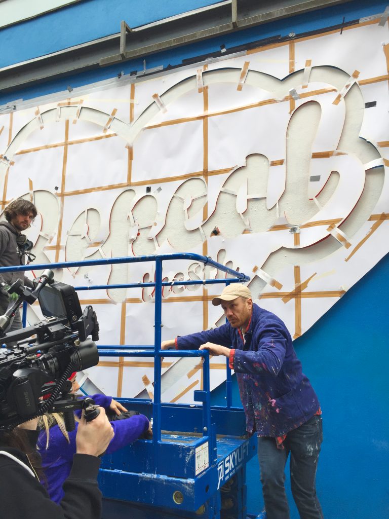 Artis Maser working on the 'repeal the 8th' mural