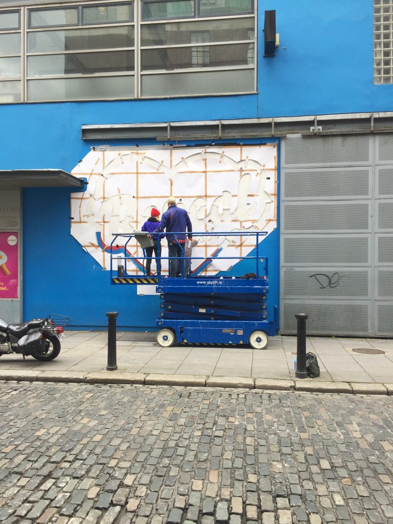 Artis Maser working on the 'repeal the 8th' mural