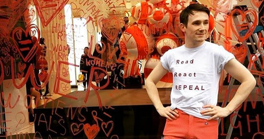 Richard Malone stands outside his Repeal Campaign Piece in the window of Selfridges