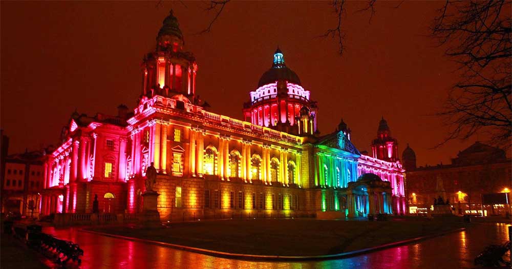Belfast city hall lit up in rainbow colours to highlight latest poll suggesting support for gay marriage