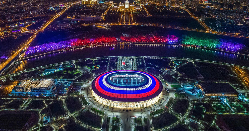 An aerial view of Russia at night, the city all lit up, the site of a vicious homophobic beating
