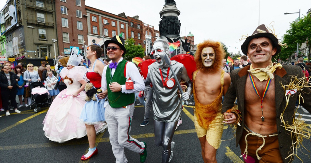A group of people dressed up as characters from The Wizard Of Oz walking in a Pride party parade down O'Connell St