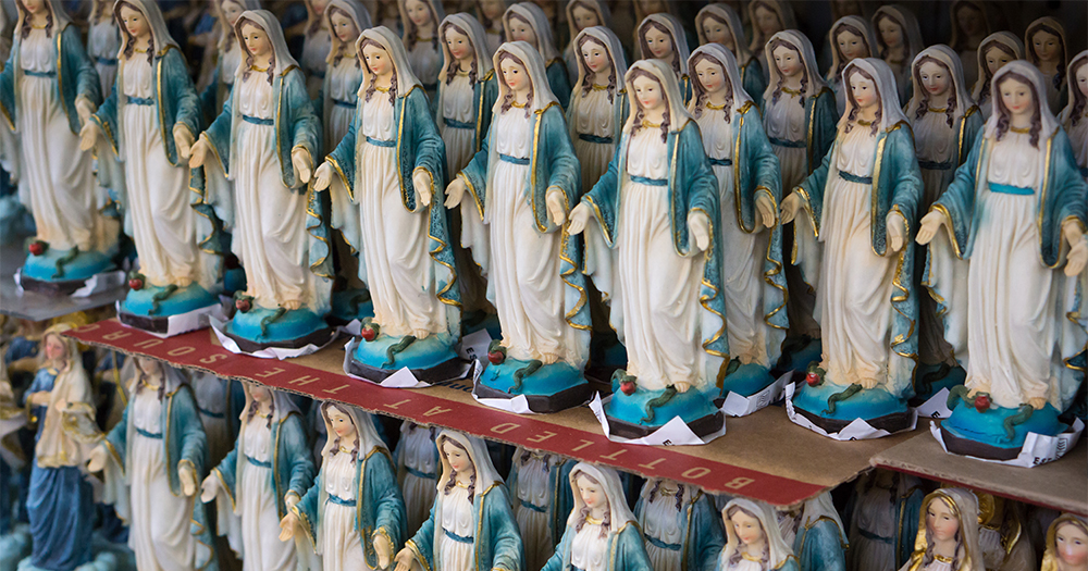 Racks of figurines of the Virgin Mary on sale in hospitals