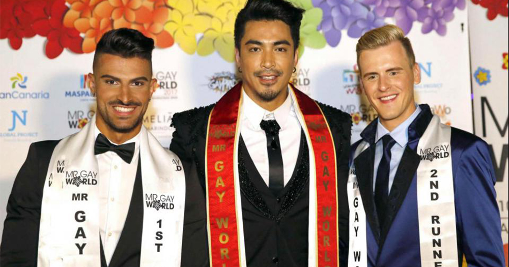 The three finalists of Mr Gay World 2017 all wearing suits and sashes