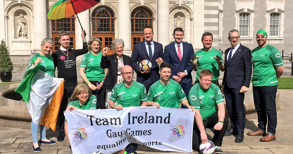 Athletes competing at the Gay Games pose with the Taoiseach and several ministers
