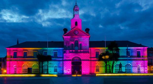 Northern Ireland town hall lit up in rainbow colours