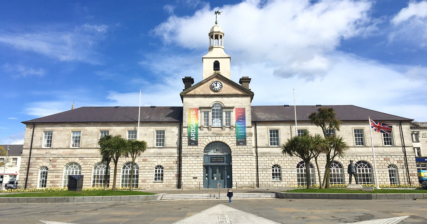 The exterior of the town hall in Newtownards with a blue sky above