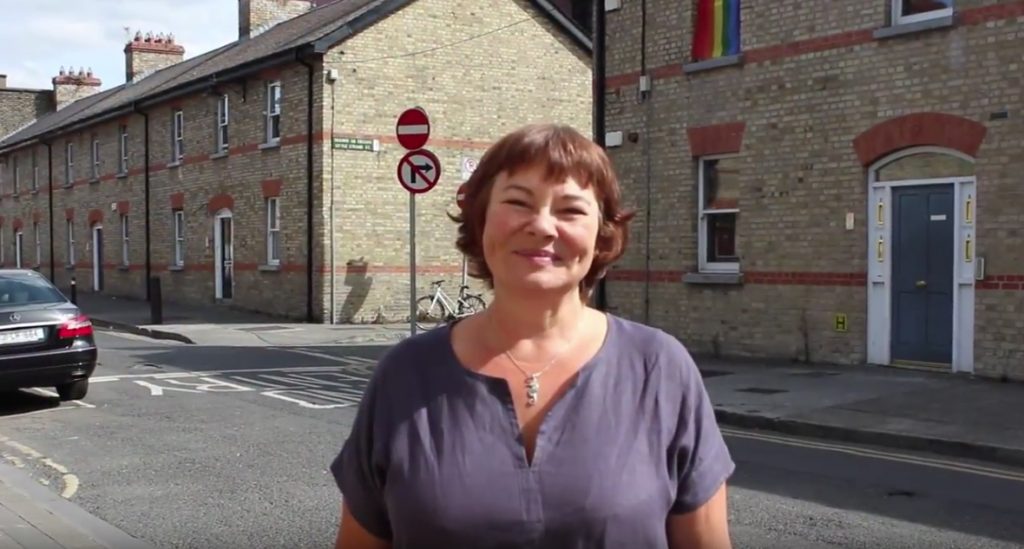 Still taken from the spoken word piece of a woman standing on the street in Dublin.
