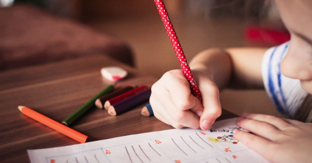 Image of a child in a classroom. Australia will take steps to prevent religious schools from discriminating against LGBT+ students.