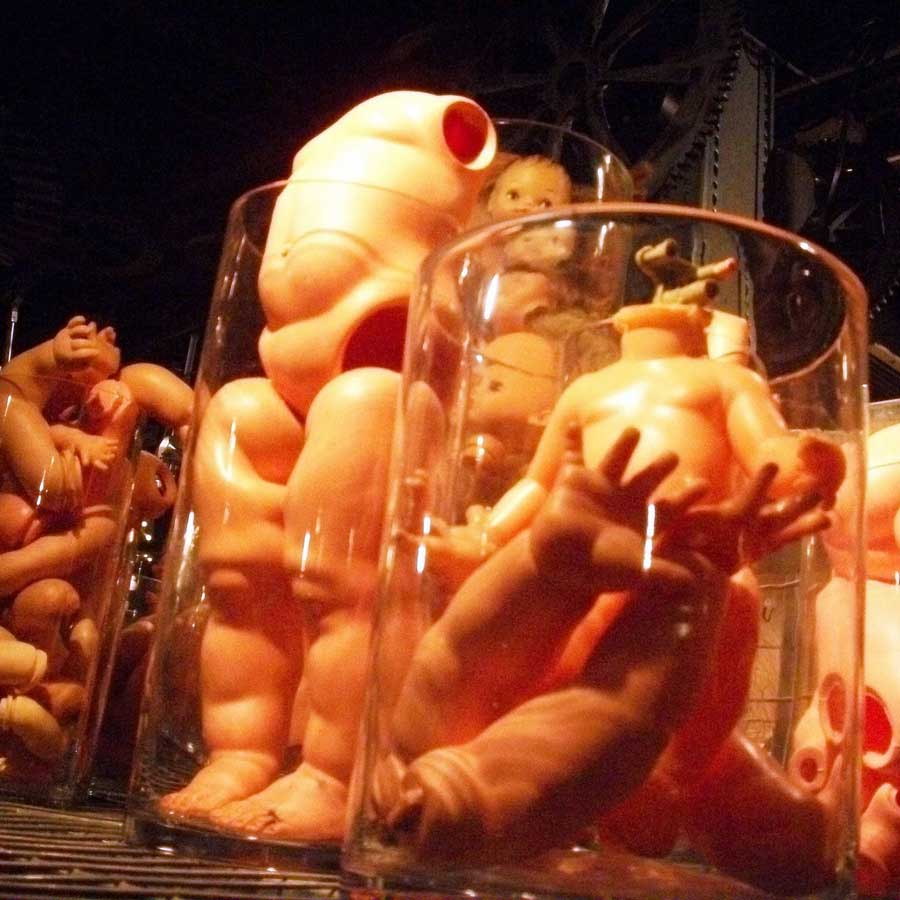 Dolls parts in a jar used as decoration for a Halloween party