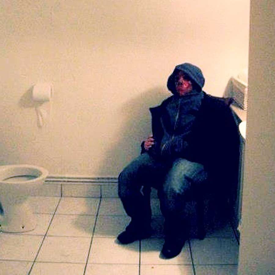 Sitting mannequin placed in a bathroom at a Halloween party