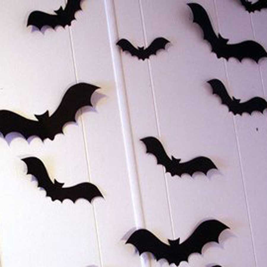 Bat silhouettes on a wall used as decoration for a Halloween party