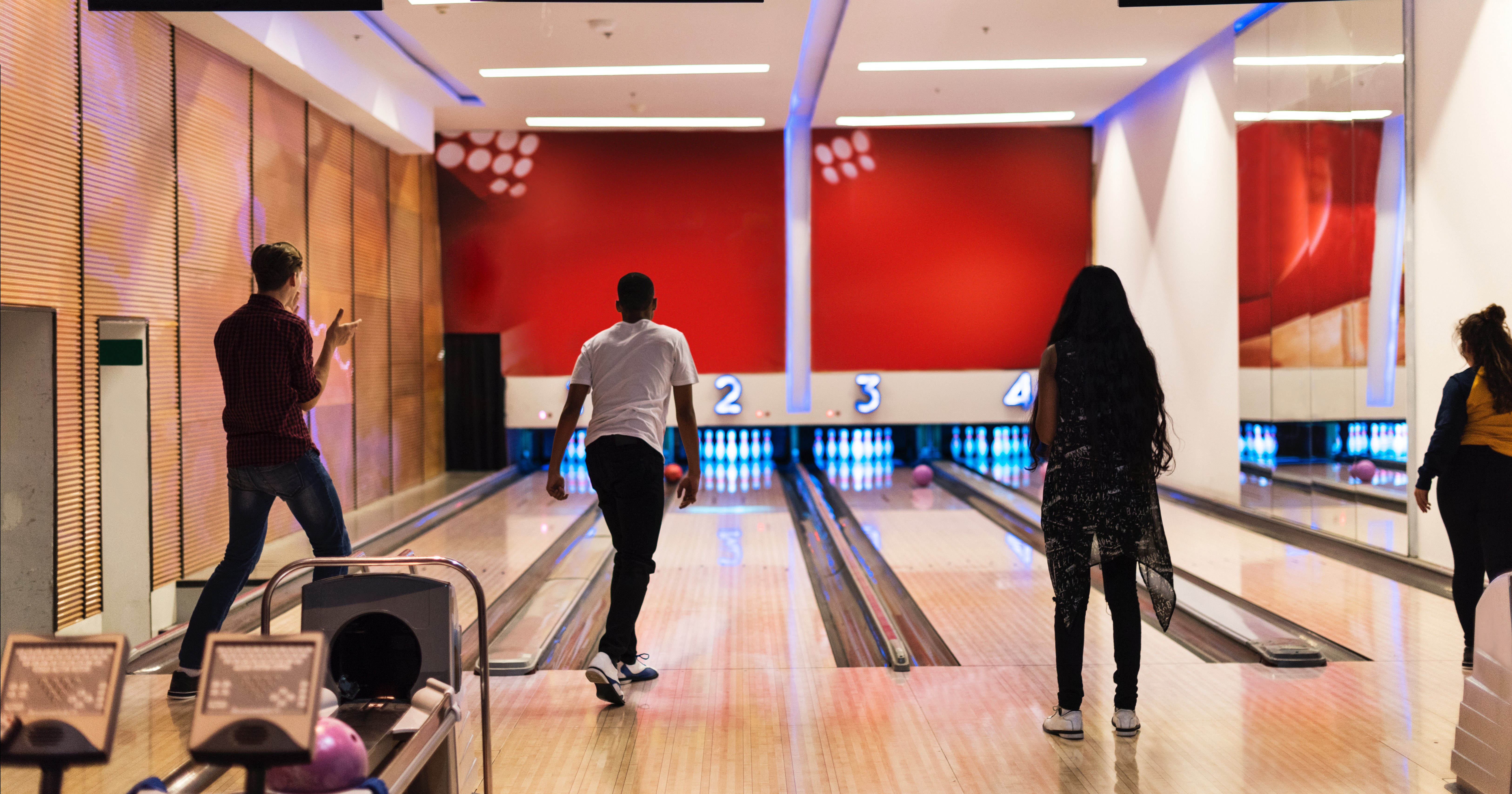 Image of people at a bowling alley.