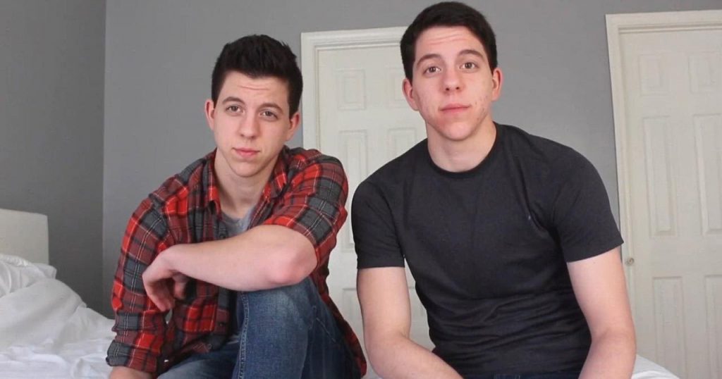 23 year-old twins Jack and Jace Grafe sit in their bedroom speaking to the camera