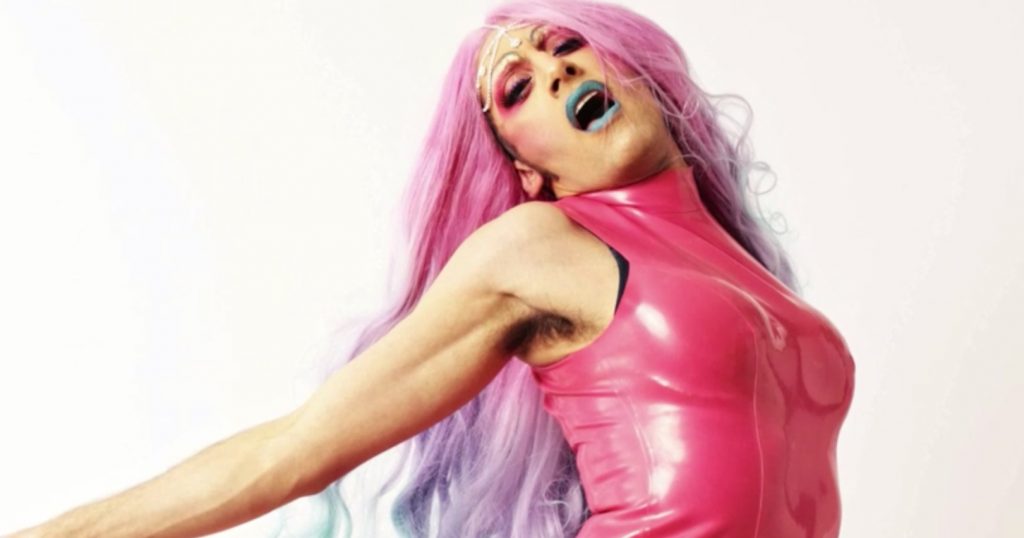 Image of Amrou Al-Khadi from the film in which they explain how quantum physics relates to the gender spectrum.