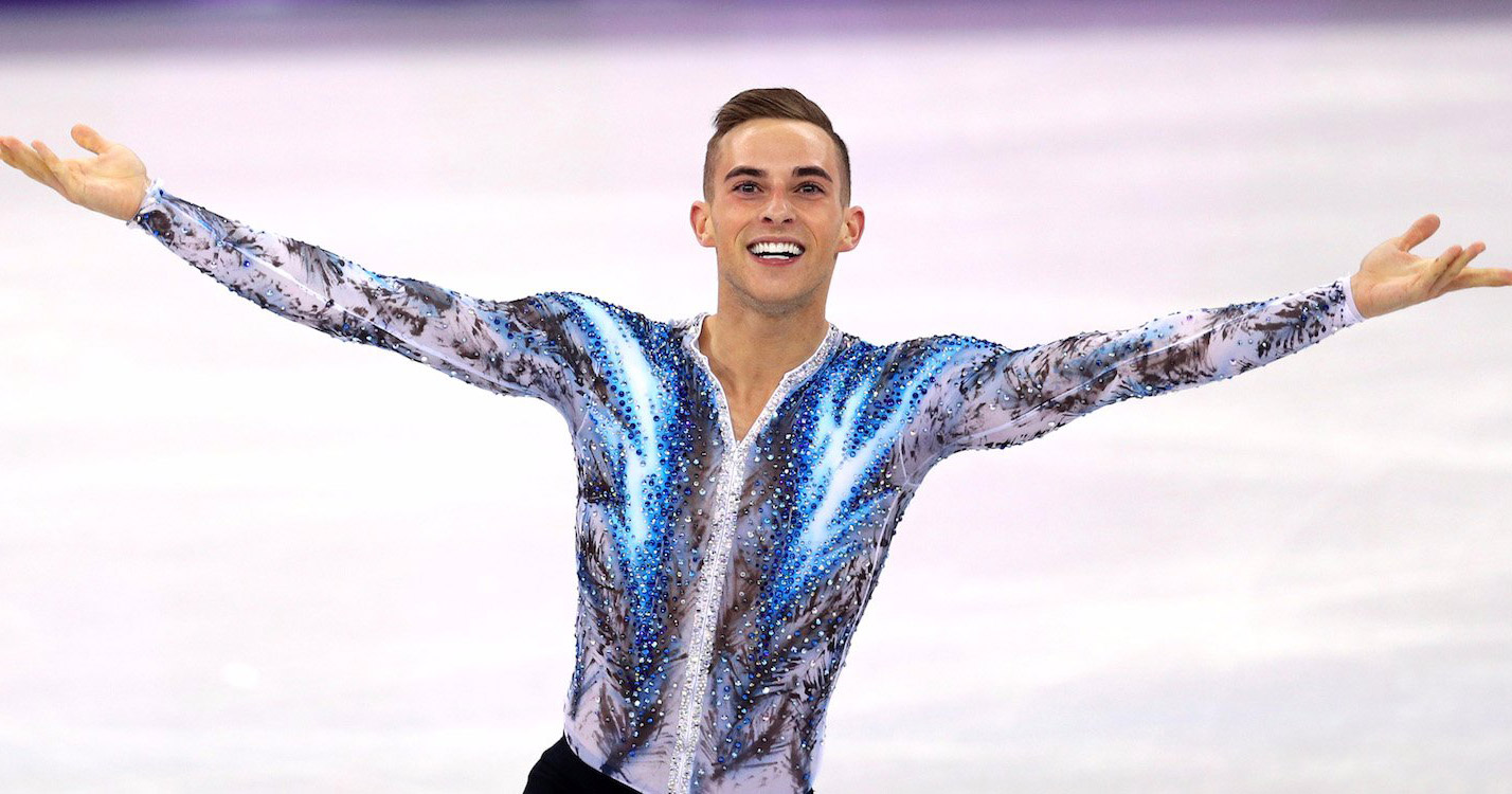 Adam Rippon skating at the Olympics looking into the audience