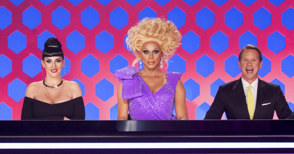 Michelle Visage, RuPaul and Carson Kressley, the judges from Ru Pul's Drag Race, sit behind their desk