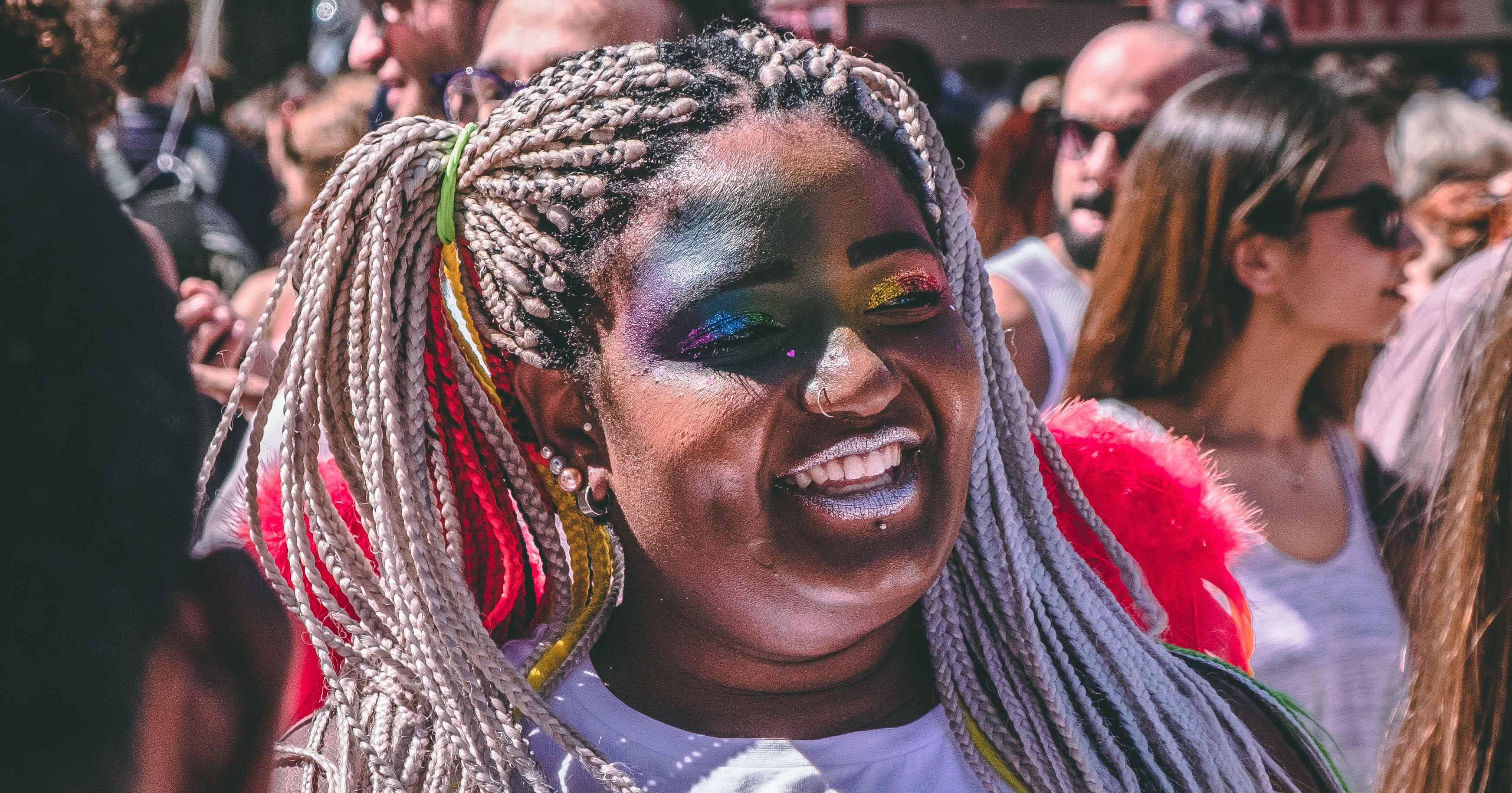 A group representing migrants at a gay Pride street celebration