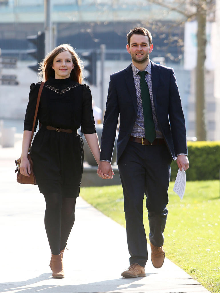 owners of the bakery that refused to make the gay cake walking together holding hands