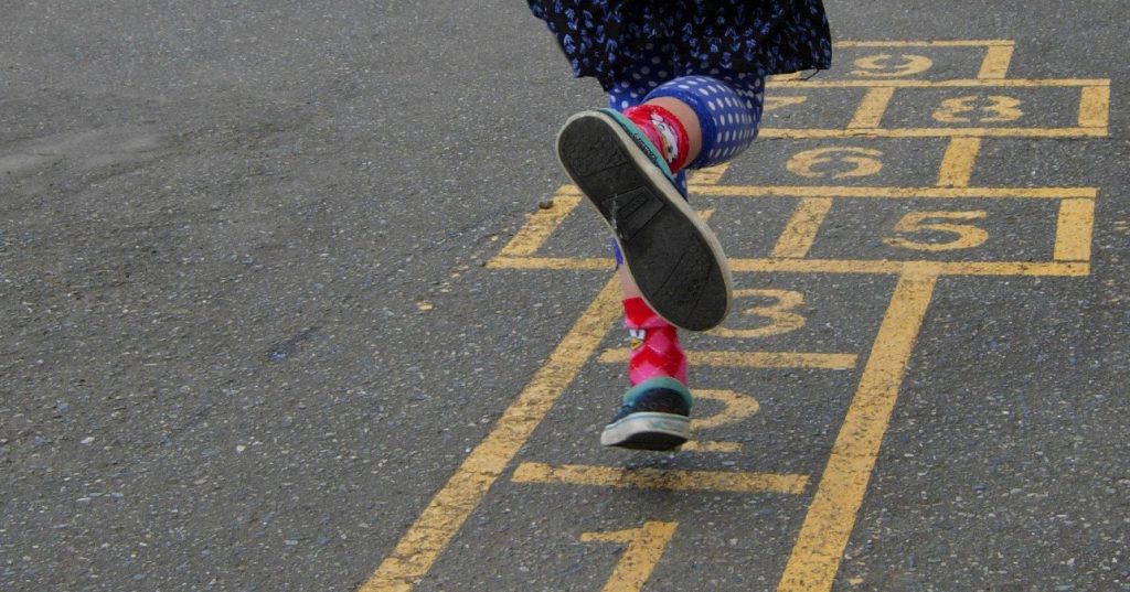 A child playing hopscotch