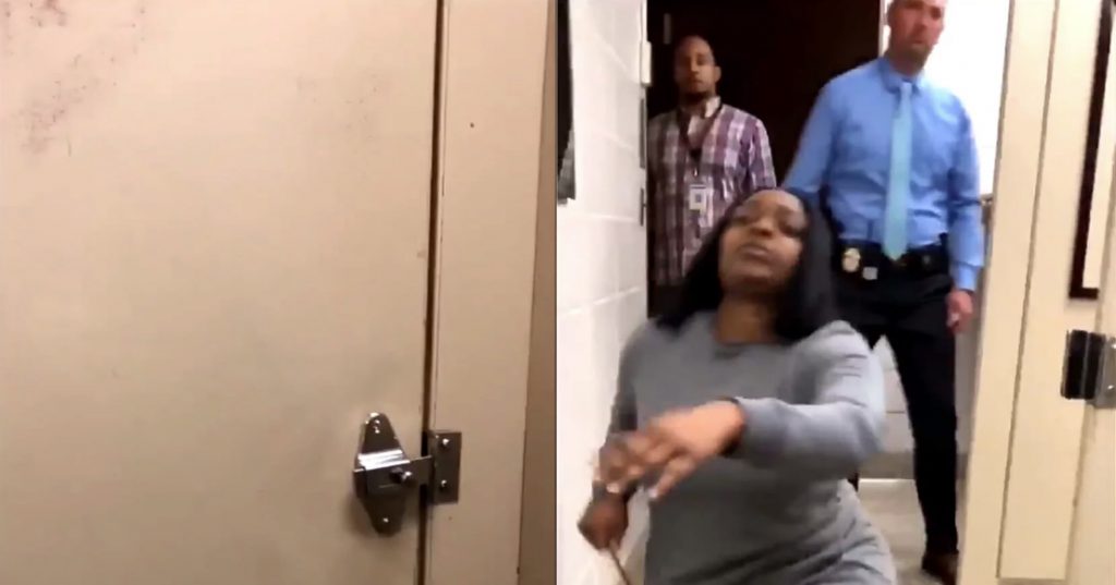 A still from the video which shows three adults inside the bathroom.