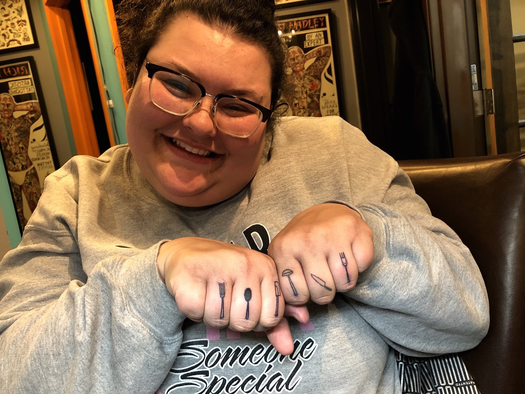 Christine Sydelko showing off the tattoos on her knuckles