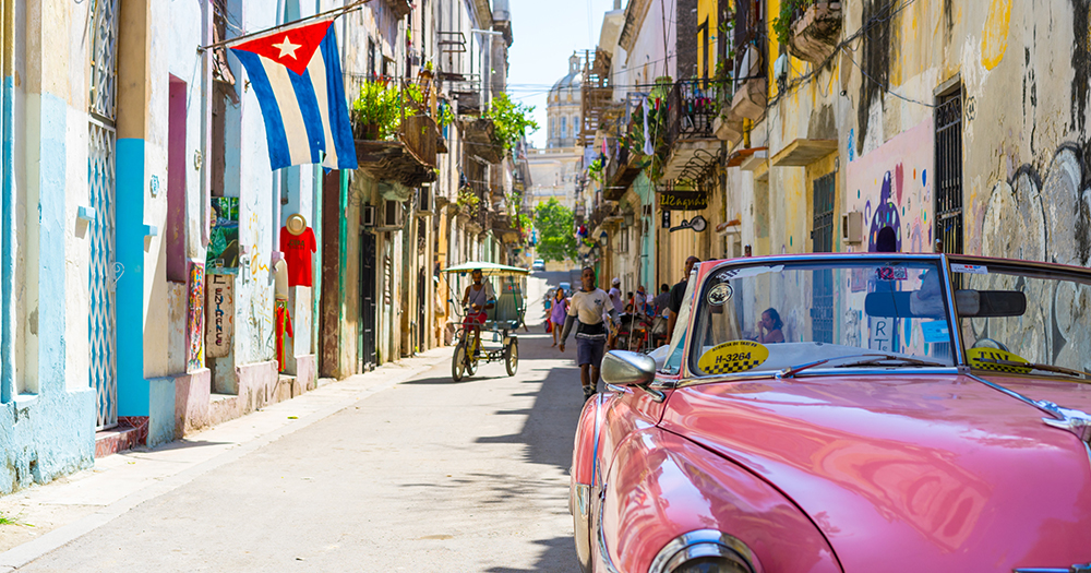 Cuba flag flown of a building on a street in Havana