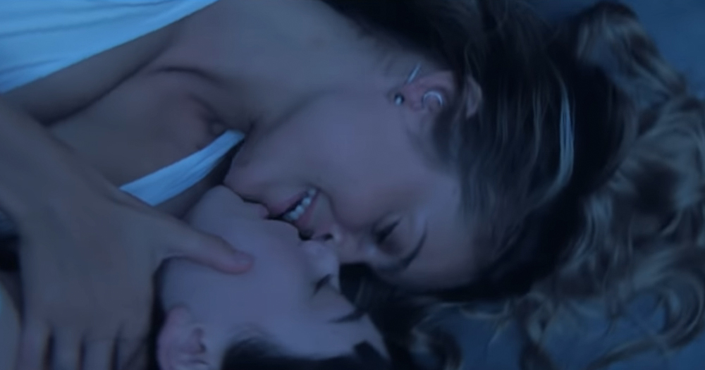A still from Wallis Bird's new video which shows two women kissing.