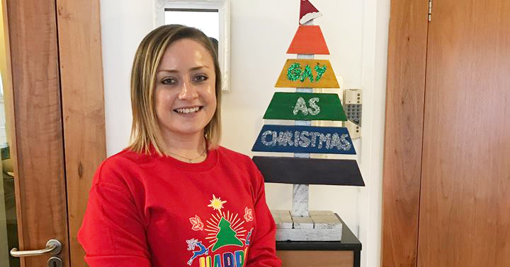 Mendicity's Head of Operations Katie Fitzsimons and our 'Gay as Christmas' tree.