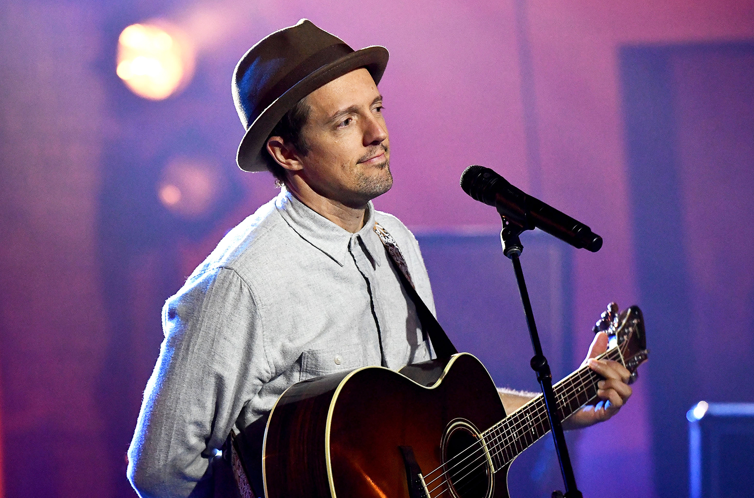 Jason Mraz performing with a guitar