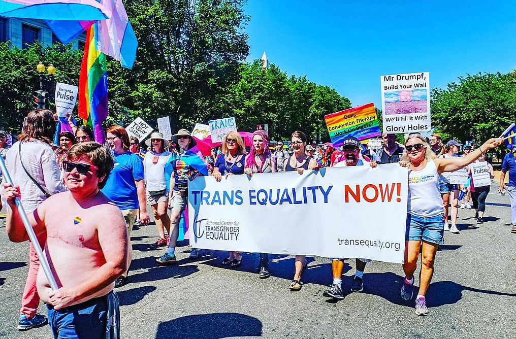 Signs calling for trans equality at San Fransisco Pride