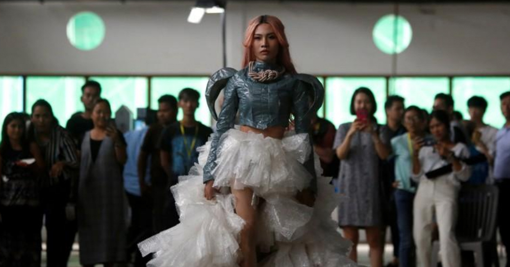 A model wears plastic couture