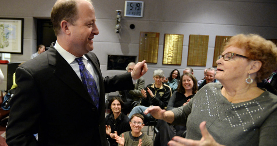 Jared Polis surprises Clela Rorex at the ceremony in the courthouse