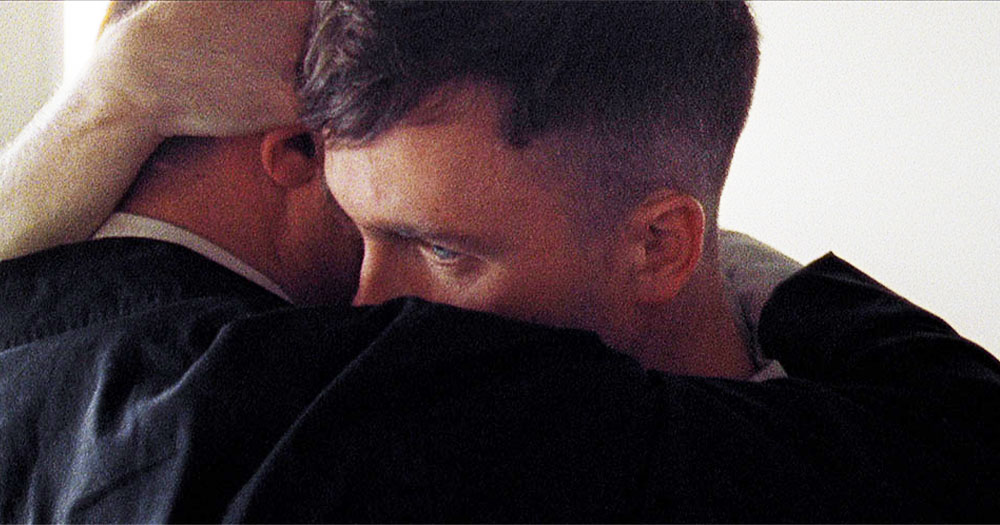 A close up of two men embracing in a still from the short film 'Wren Boys'