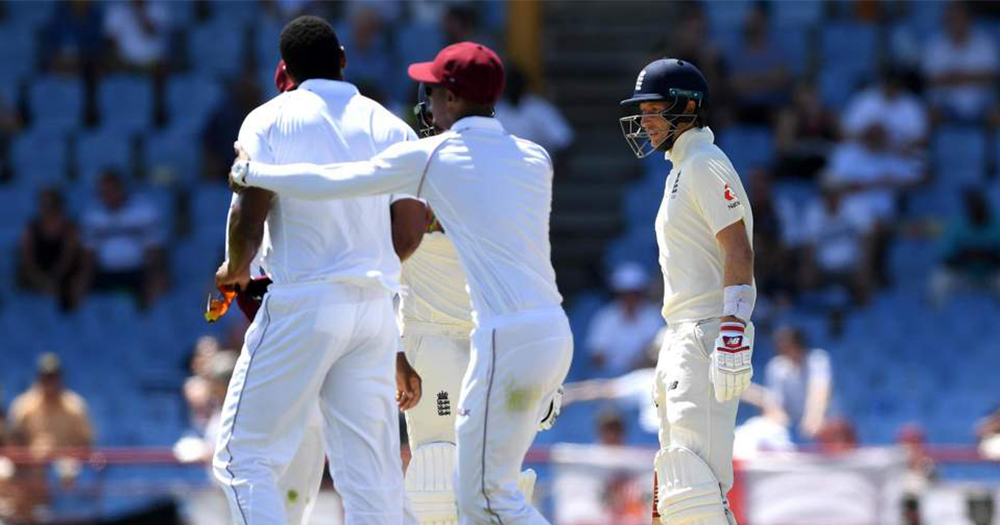 West Indies player Shannon Gabriels angrily confronts English cricket captain Joe Root at a match while another player holds him back