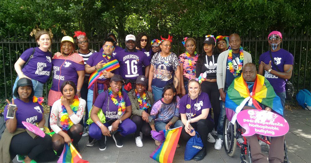 Members of Identity - the LGBT+ asylum seekers group gathered dressed in Pride outfits